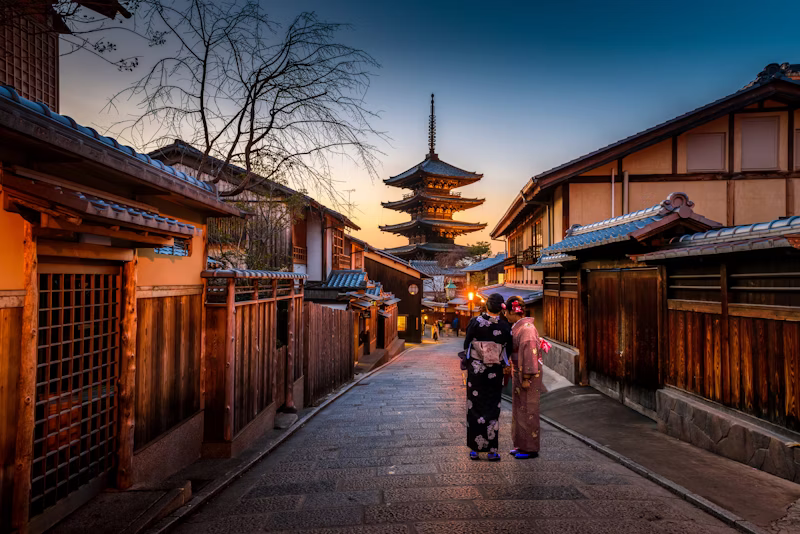 Traditional Japanese temple with cherry blossoms in Kyoto